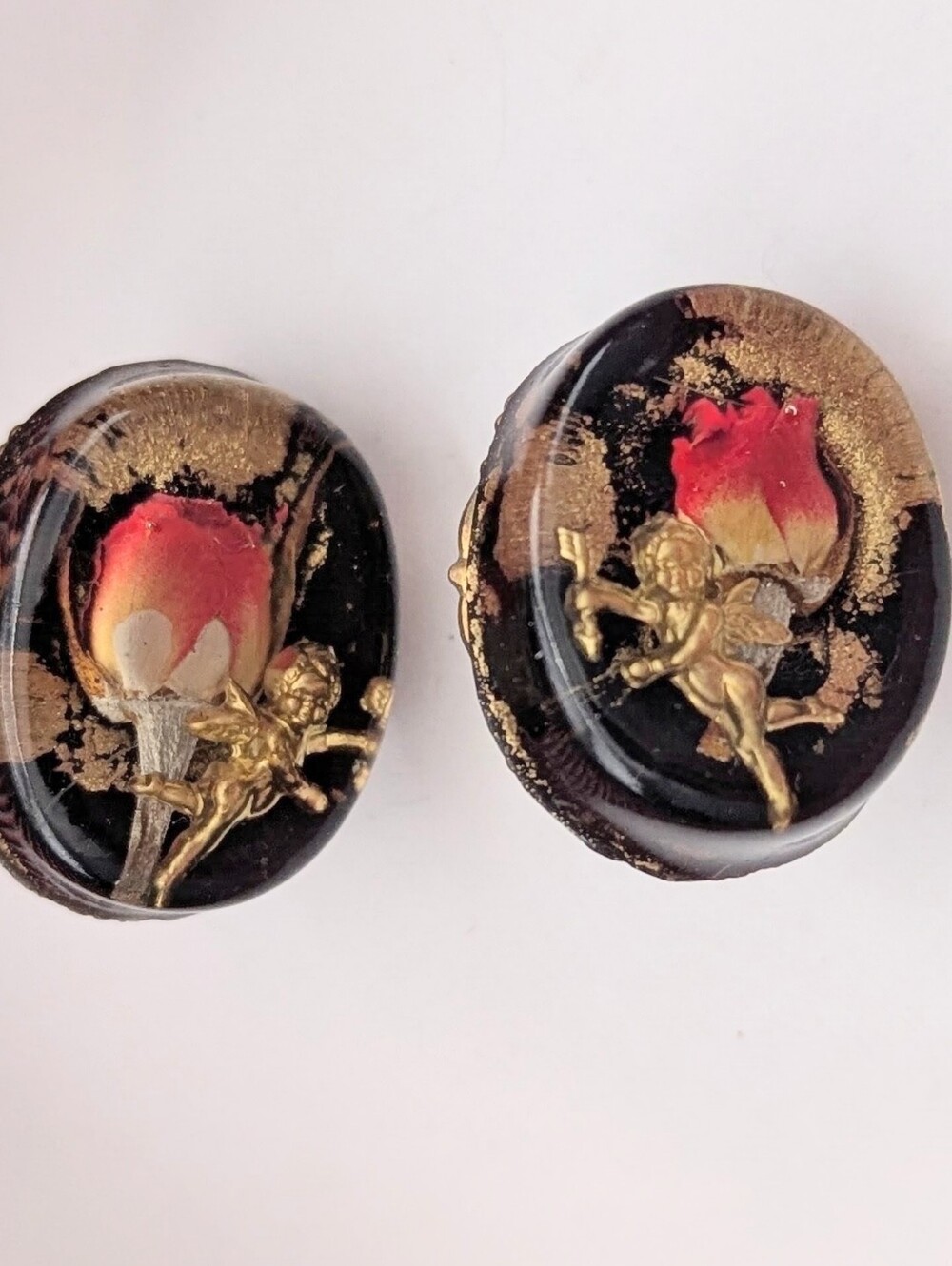 Preserved Red Rose & Gold Cupid Clip-On Oval-Shaped Earings Set In Glossy Black